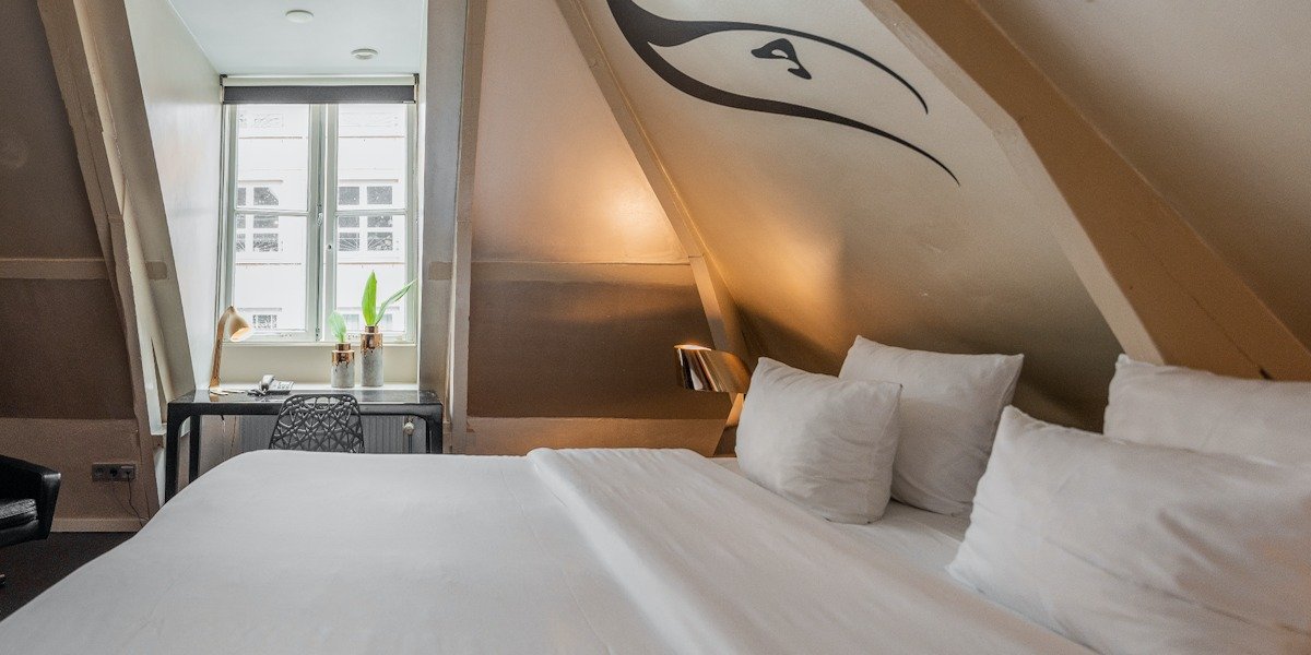 europe-city-hotel-attic-room-1200x600